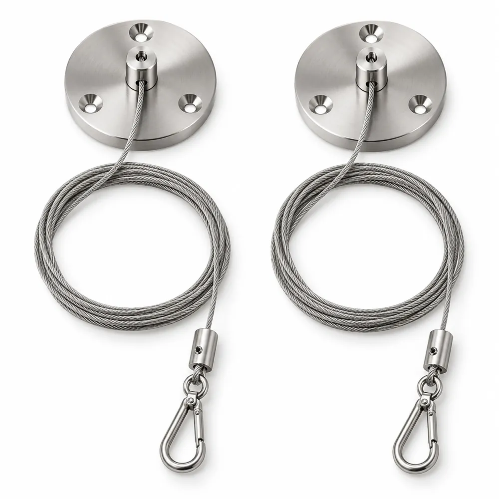 Ceiling hanging kit laid out: two round ceiling discs, thin steel cables and grippers with snap hooks, on a white background