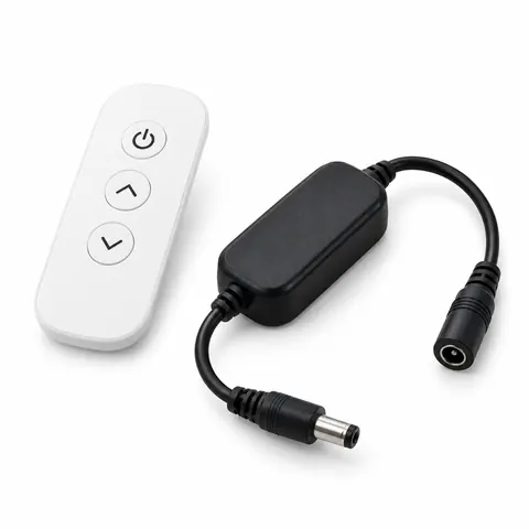 Remote dimmer set: small white wireless remote beside a black in-line receiver with DC barrel plugs, on a white background