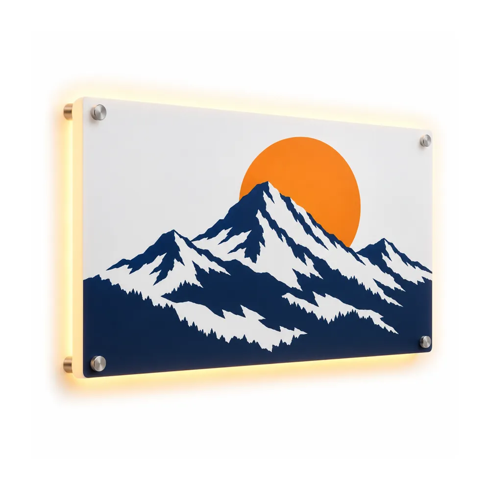 Backlit printed acrylic sign: navy mountains and an orange sun on a white panel on standoffs, with a warm white halo, on a white background